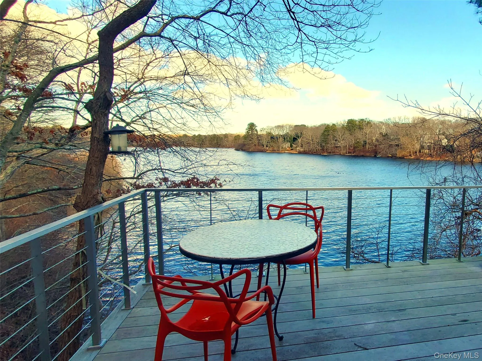 Dock area with a water view and a balcony Dock area with a water view and a balcony