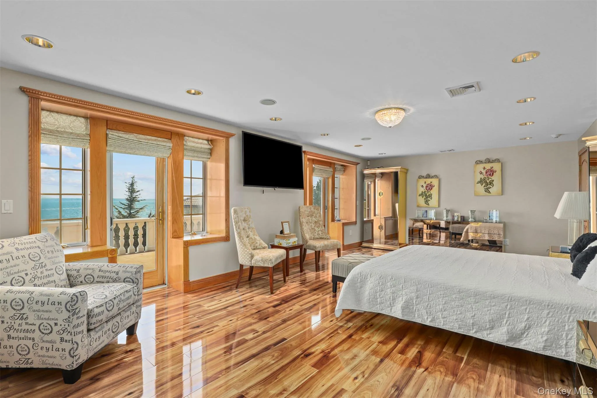 Bedroom with baseboards, visible vents, recessed lighting, access to outside, and light wood-type flooring Bedroom with baseboards, visible vents, recessed lighting, access to outside, and light wood-type flooring