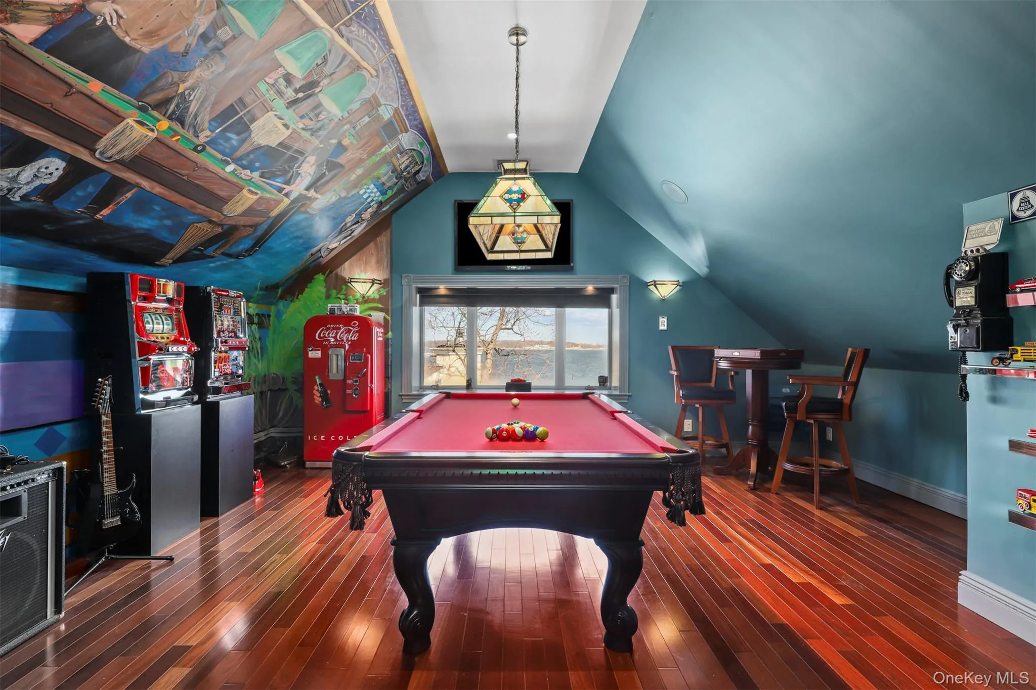 Playroom featuring hardwood / wood-style flooring, billiards, baseboards, and lofted ceiling Playroom featuring hardwood / wood-style flooring, billiards, baseboards, and lofted ceiling