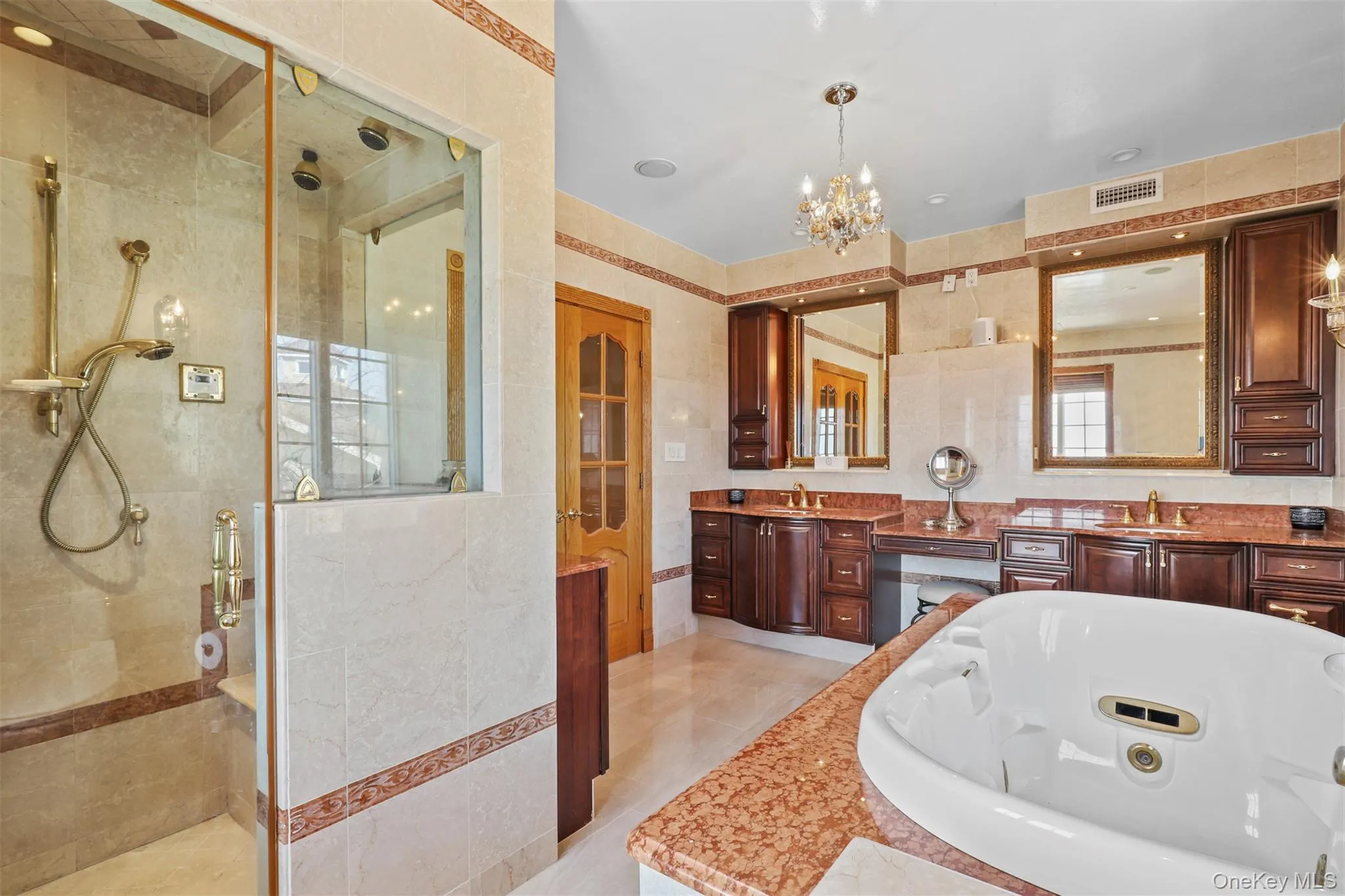 Bathroom with tile walls, a tile shower, a whirlpool tub, and a sink Bathroom with tile walls, a tile shower, a whirlpool tub, and a sink