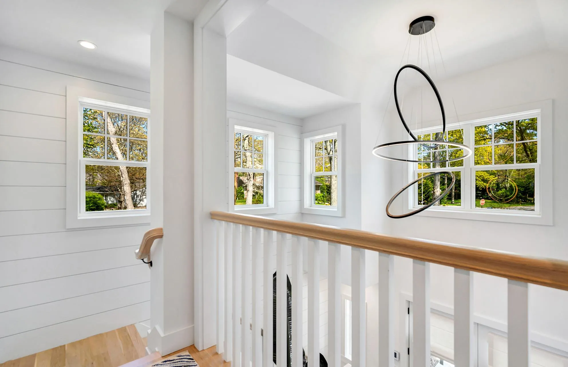 Details with hardwood / wood-style flooring and wood walls Details with hardwood / wood-style flooring and wood walls