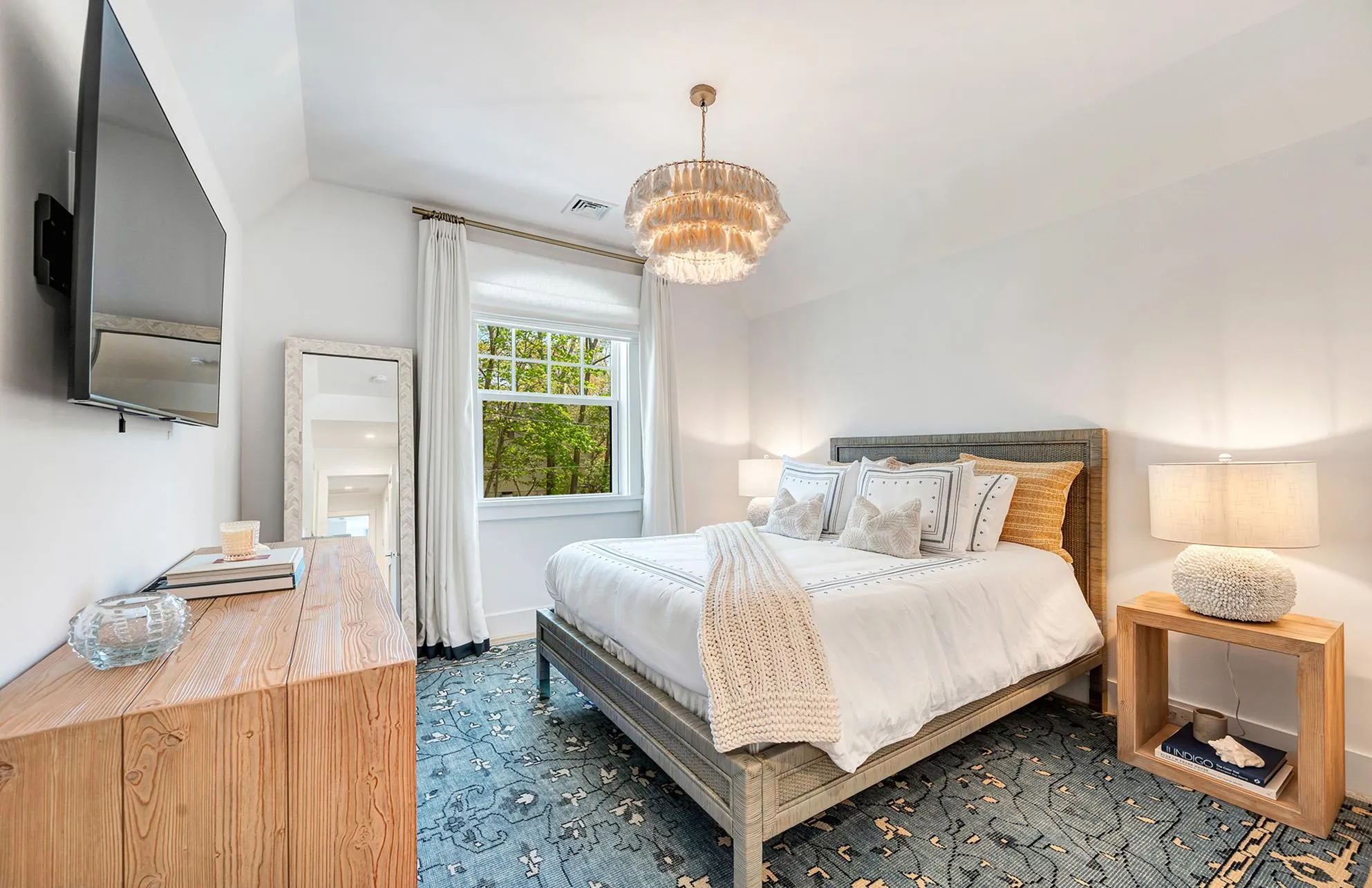 Bedroom featuring vaulted ceiling and a chandelier Bedroom featuring vaulted ceiling and a chandelier
