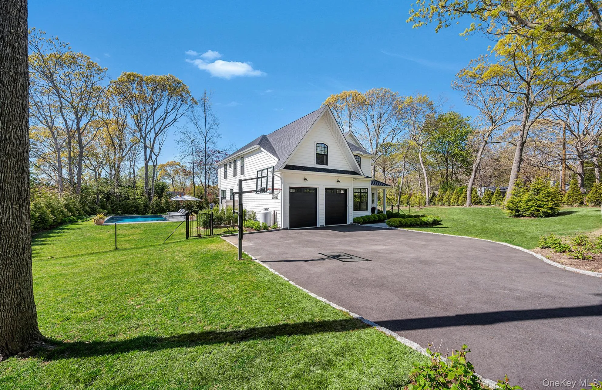 View of property exterior with a garage and a lawn View of property exterior with a garage and a lawn