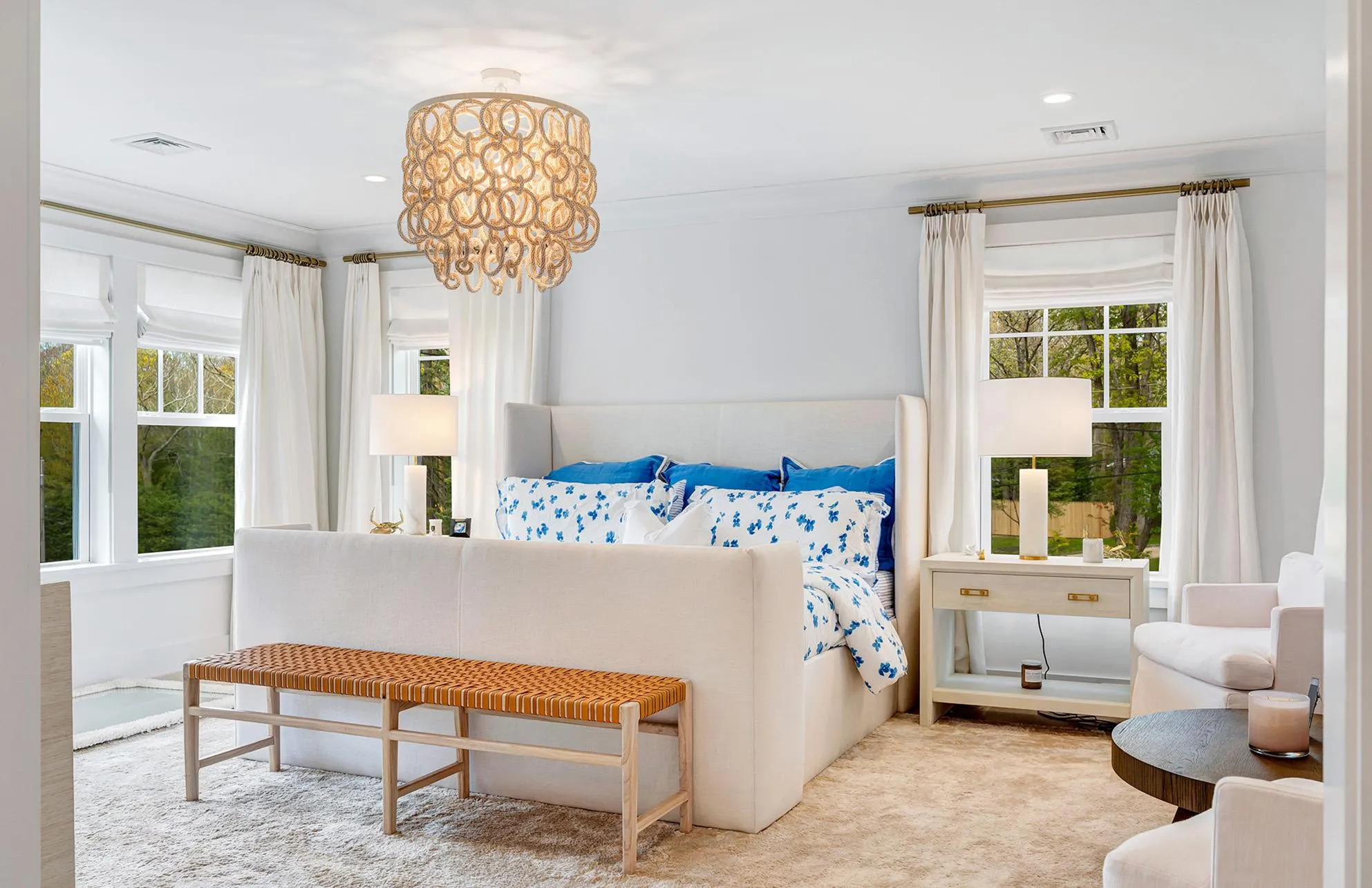 Carpeted bedroom with ornamental molding and a chandelier Carpeted bedroom with ornamental molding and a chandelier