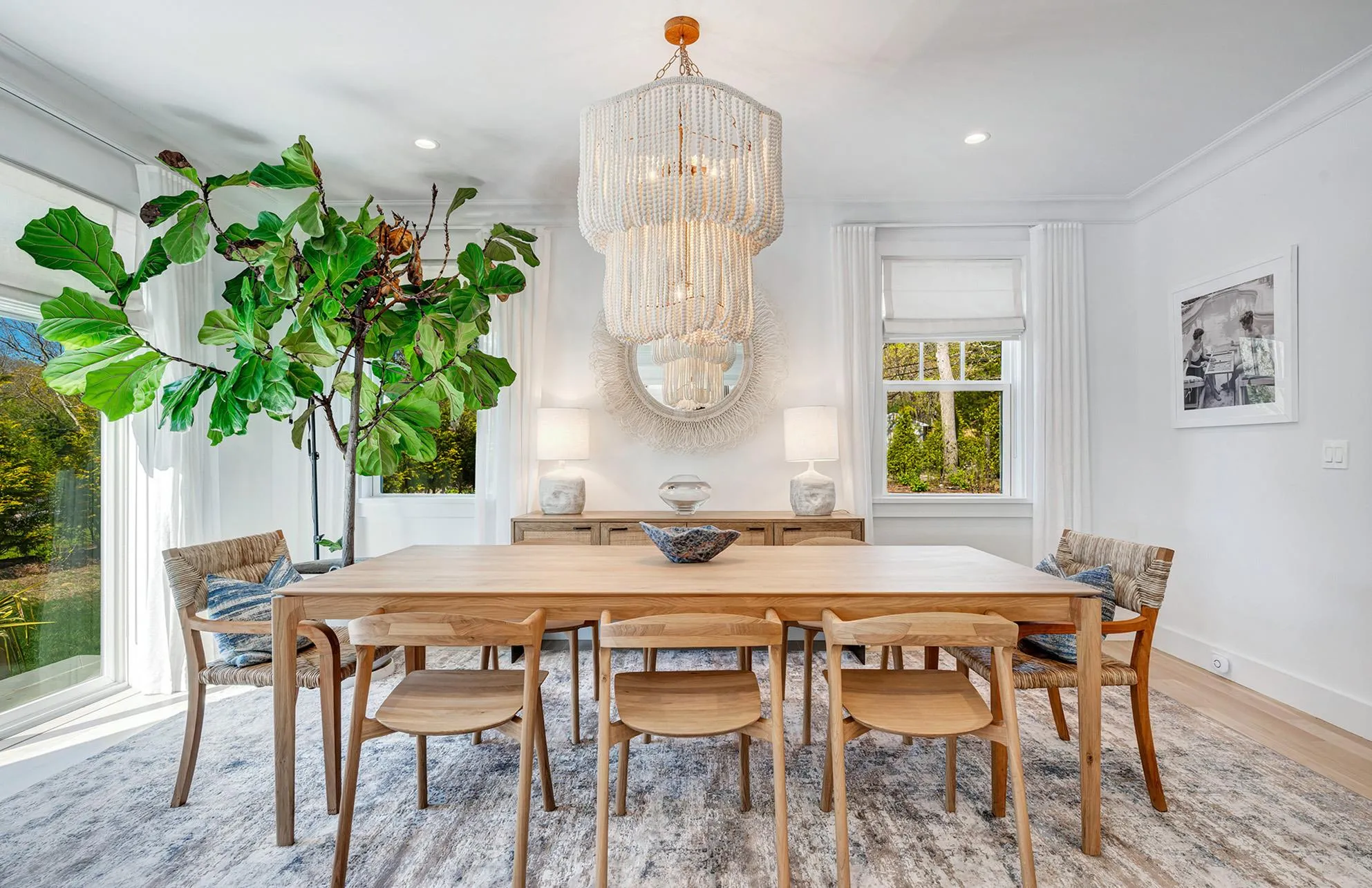 Dining room with crown molding, an inviting chandelier, and hardwood / wood-style floors Dining room with crown molding, an inviting chandelier, and hardwood / wood-style floors