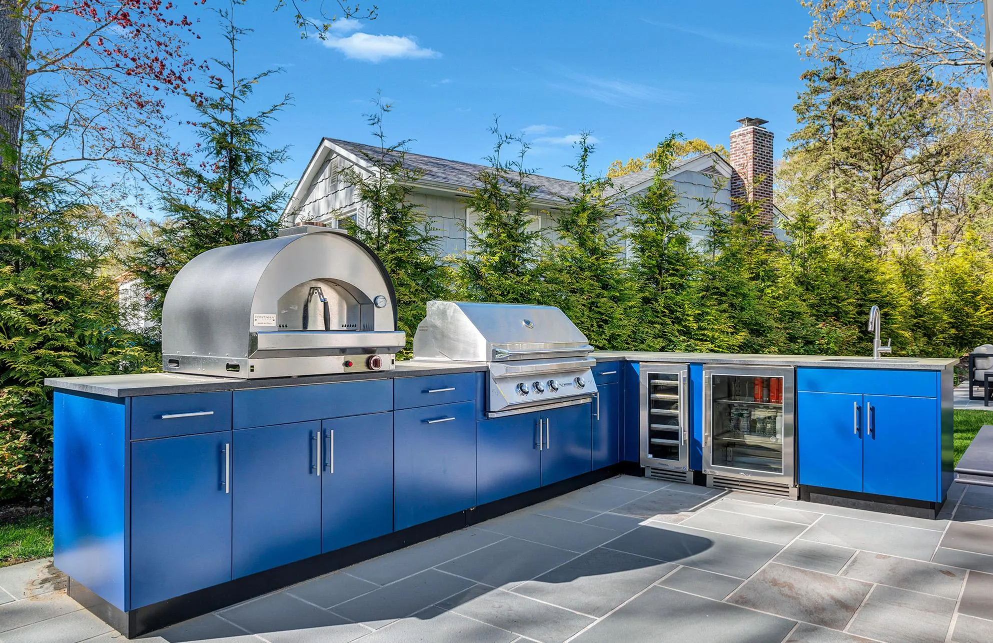 View of patio with wine cooler, a grill, sink, and exterior kitchen View of patio with wine cooler, a grill, sink, and exterior kitchen