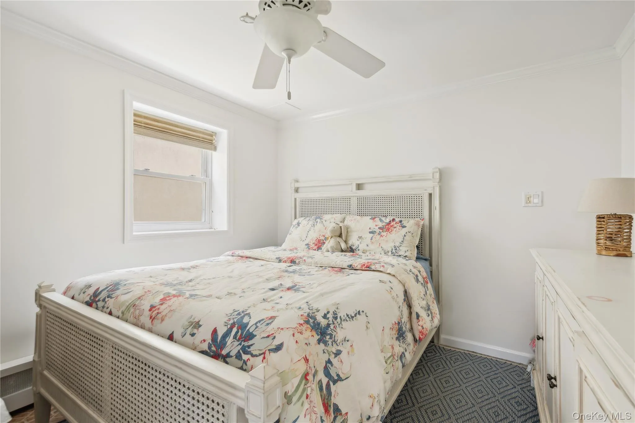 Bedroom with crown molding and ceiling fan Bedroom with crown molding and ceiling fan