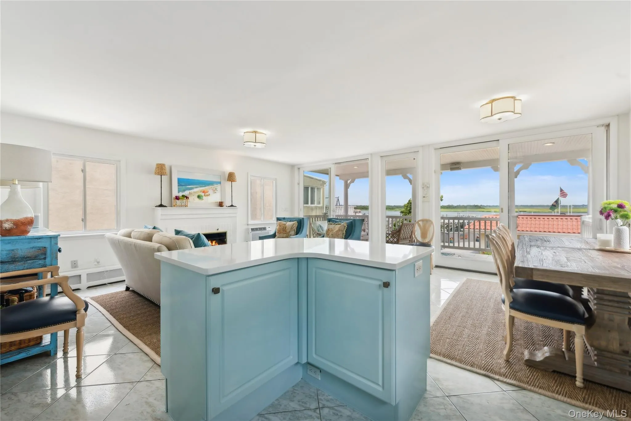 Kitchen with a center island, blue cabinetry, and light tile patterned floors Kitchen with a center island, blue cabinetry, and light tile patterned floors