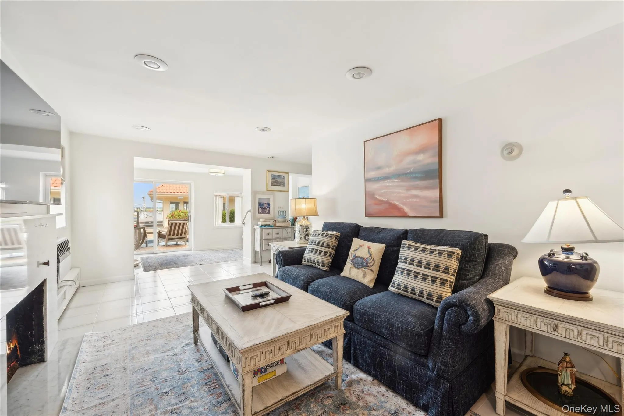 Living room featuring light tile patterned floors Living room featuring light tile patterned floors