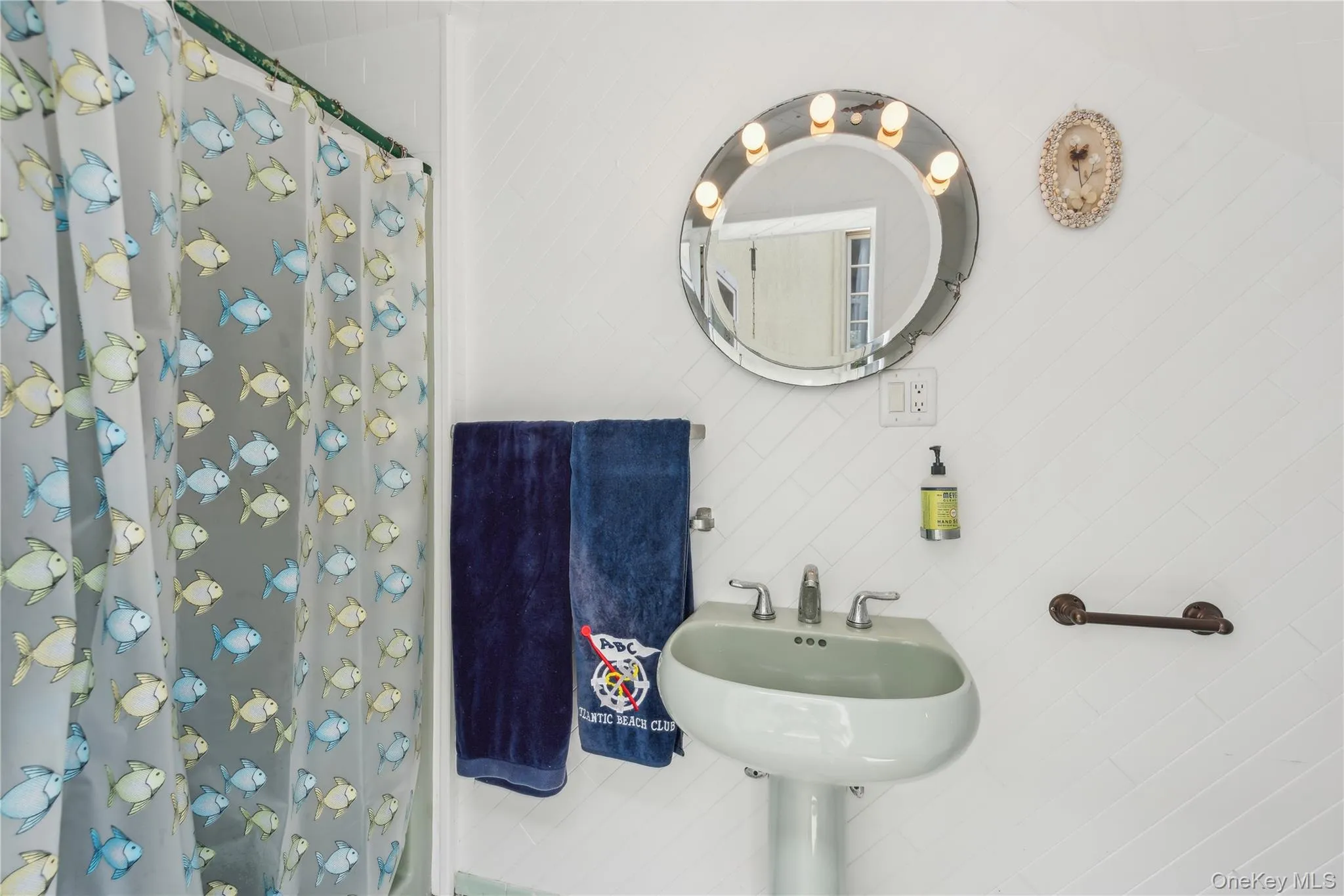 Bathroom with sink and a shower with curtain Bathroom with sink and a shower with curtain