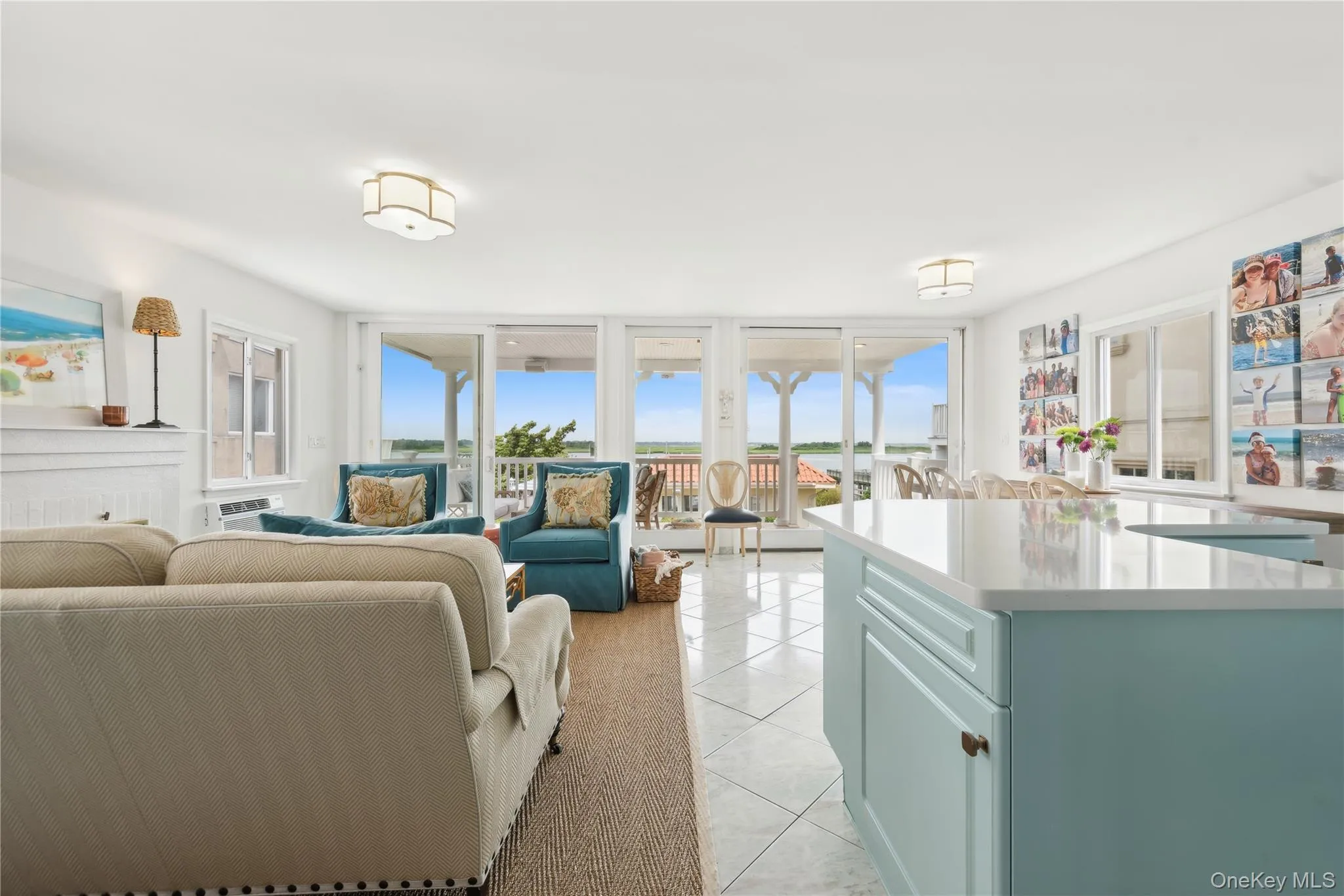 Tiled living room with expansive windows Tiled living room with expansive windows