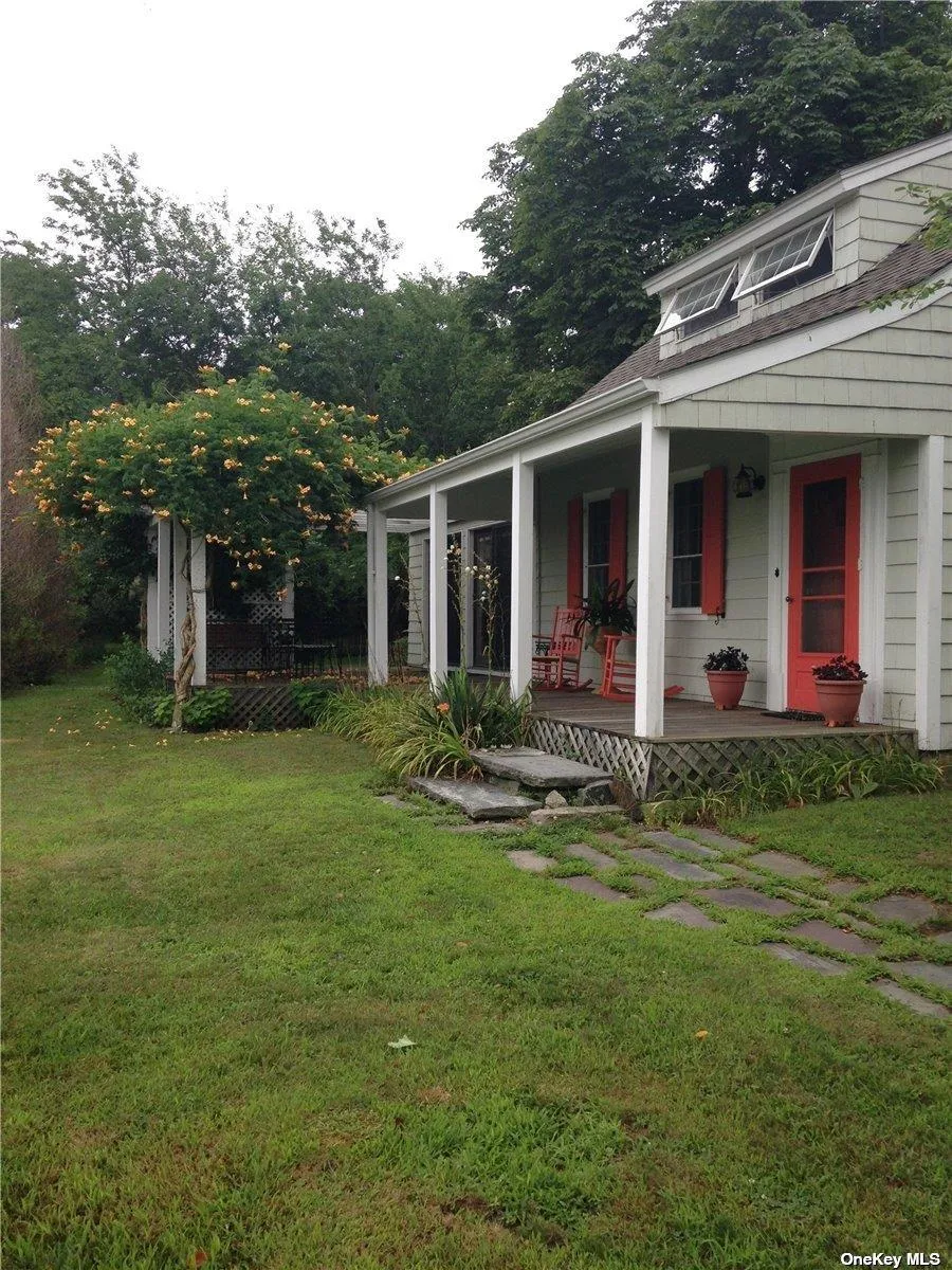 View of yard featuring a porch View of yard featuring a porch