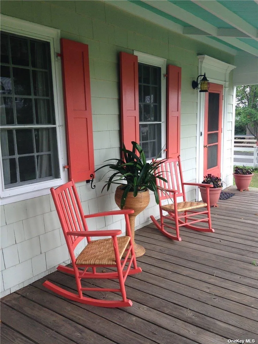 Wooden terrace featuring covered porch Wooden terrace featuring covered porch