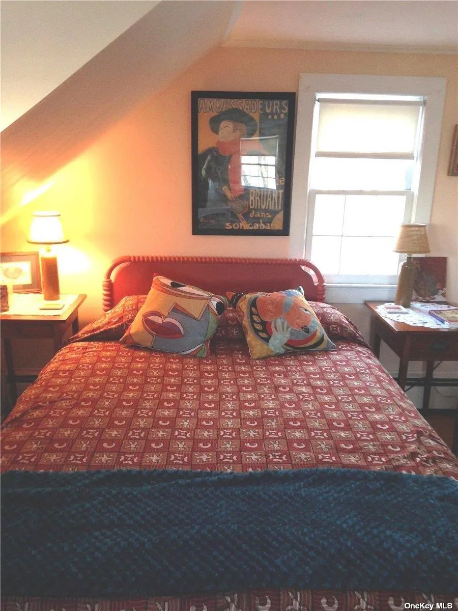 Bedroom featuring lofted ceiling Bedroom featuring lofted ceiling