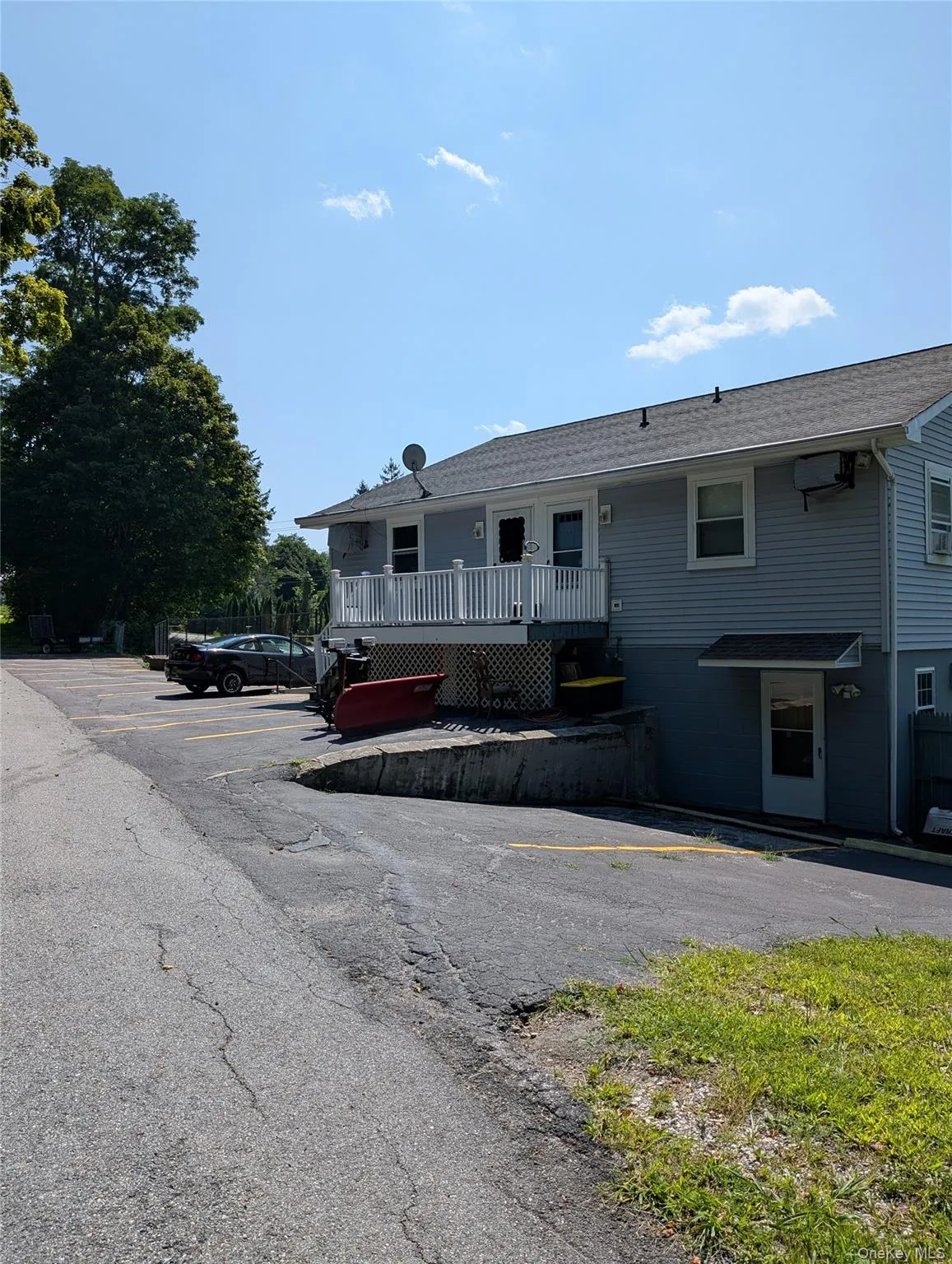 View of rear facade featuring with newly paved and designated parking View of rear facade featuring with newly paved and designated parking
