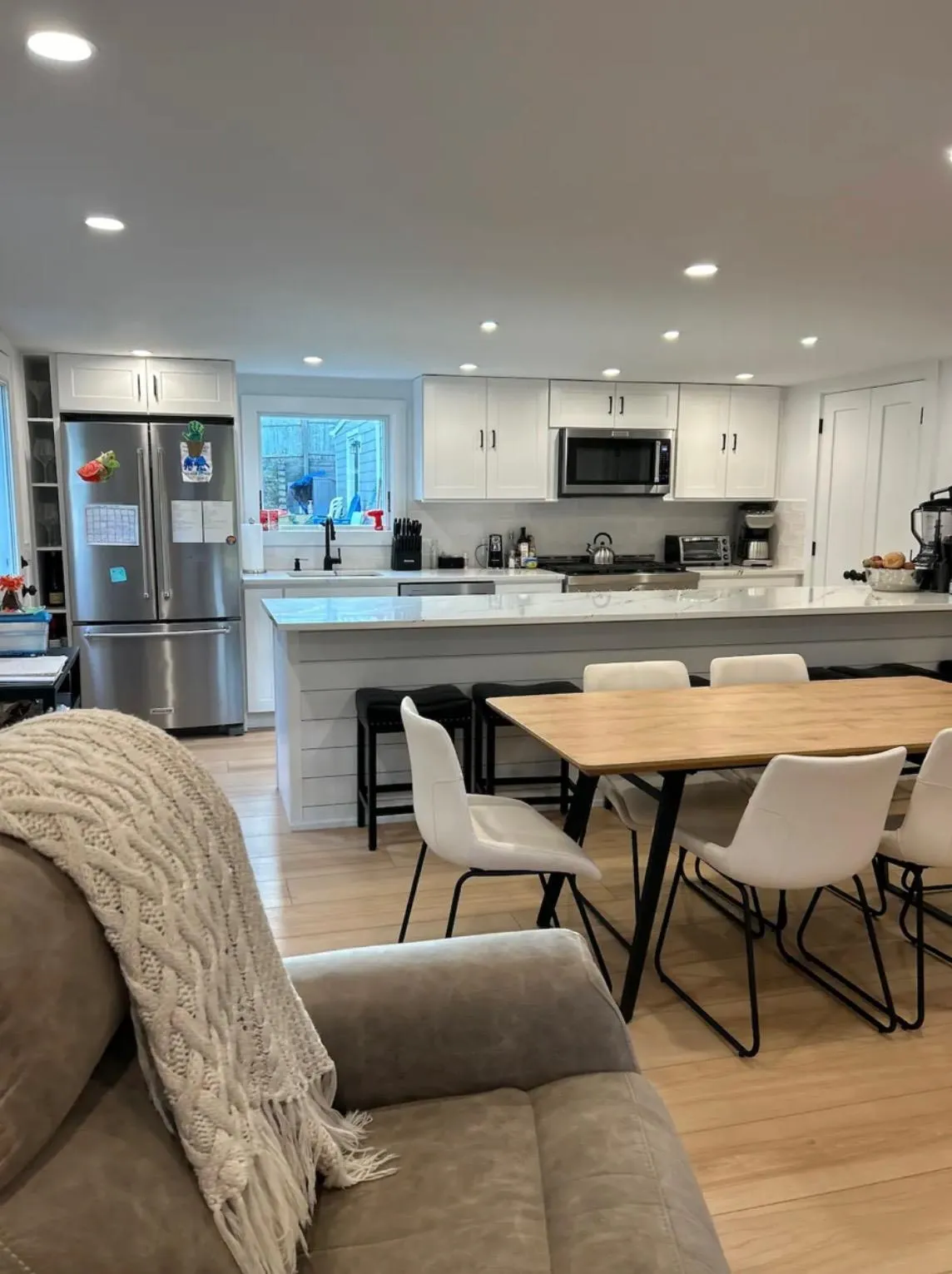 Dining area featuring sink and light hardwood / wood-style floors Dining area featuring sink and light hardwood / wood-style floors