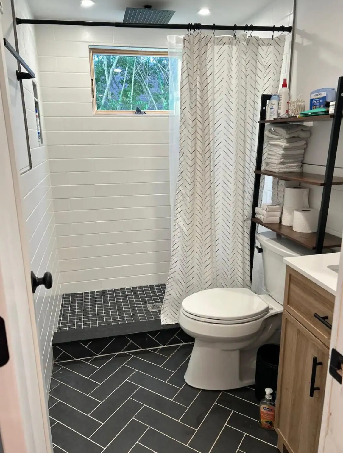 Bathroom featuring vanity, toilet, and walk in shower Bathroom featuring vanity, toilet, and walk in shower