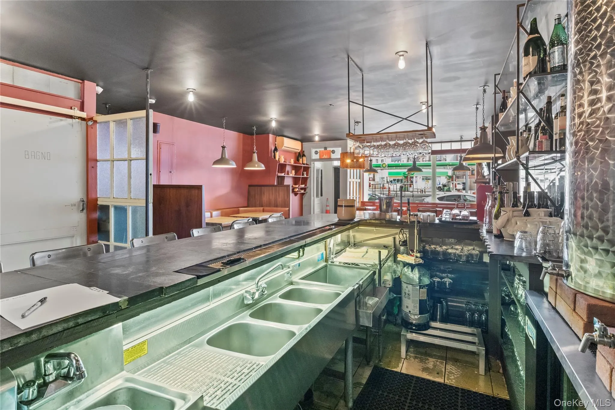 Kitchen featuring hanging light fixtures and sink Kitchen featuring hanging light fixtures and sink