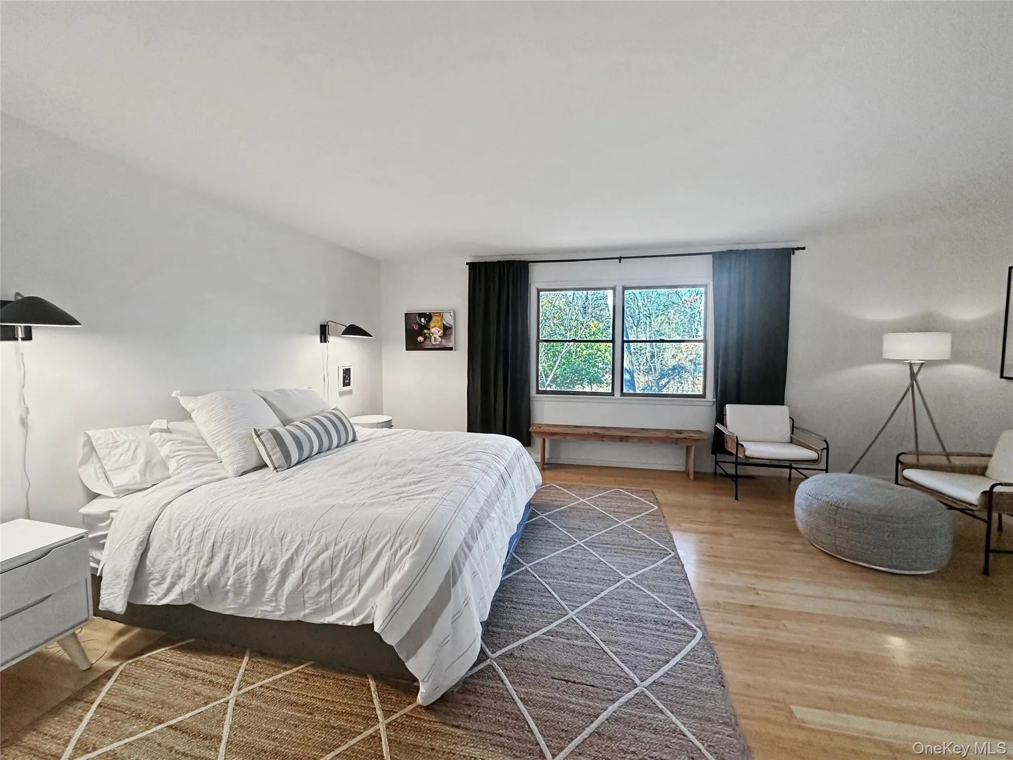 Bedroom featuring hardwood / wood-style flooring Bedroom featuring hardwood / wood-style flooring