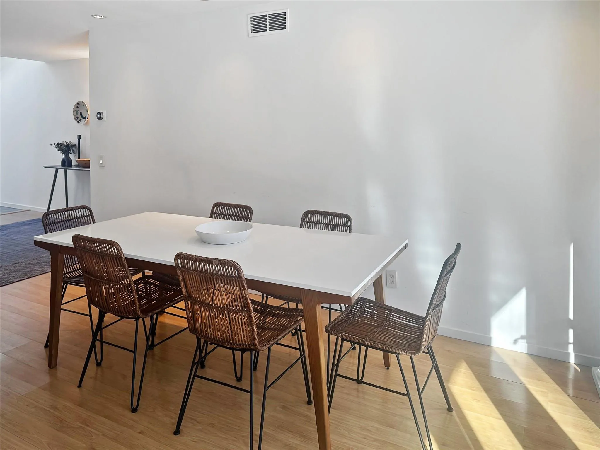 Dining area with light hardwood / wood-style flooring Dining area with light hardwood / wood-style flooring