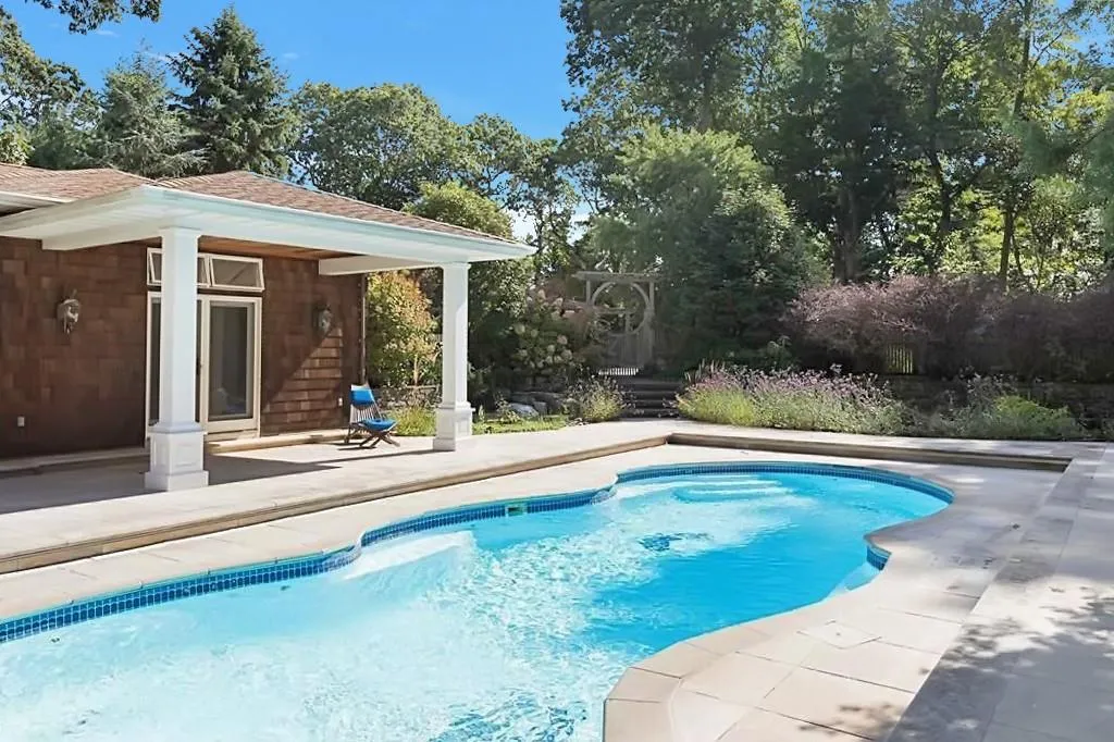 View of pool with an outbuilding and a patio View of pool with an outbuilding and a patio