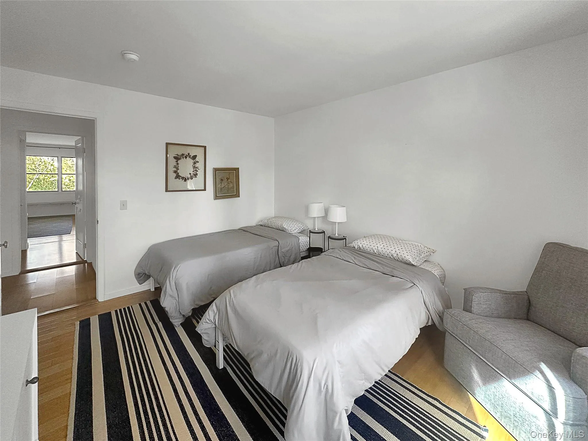 Bedroom featuring hardwood / wood-style flooring Bedroom featuring hardwood / wood-style flooring