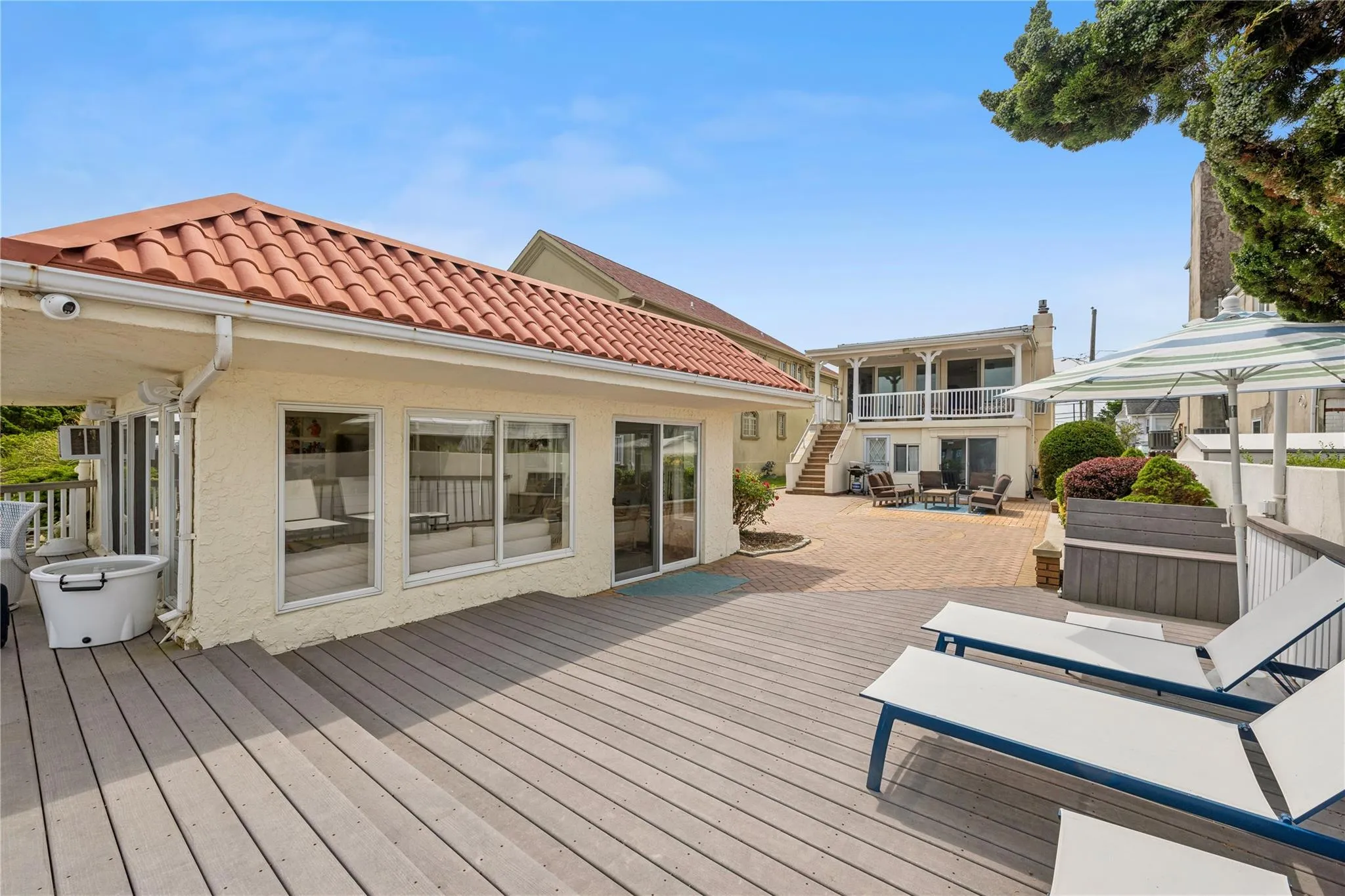 Wooden deck featuring a patio area Wooden deck featuring a patio area