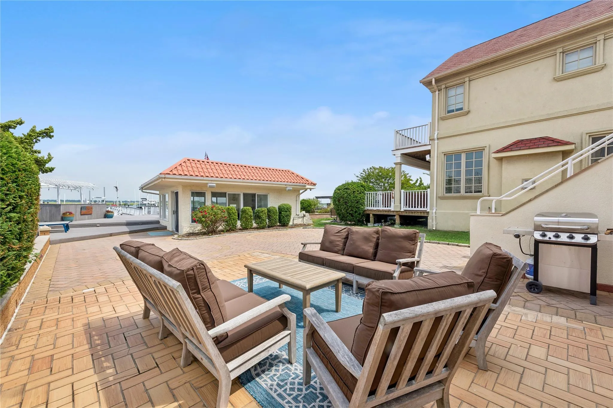 View of patio featuring grilling area, an outdoor living space, and a balcony View of patio featuring grilling area, an outdoor living space, and a balcony