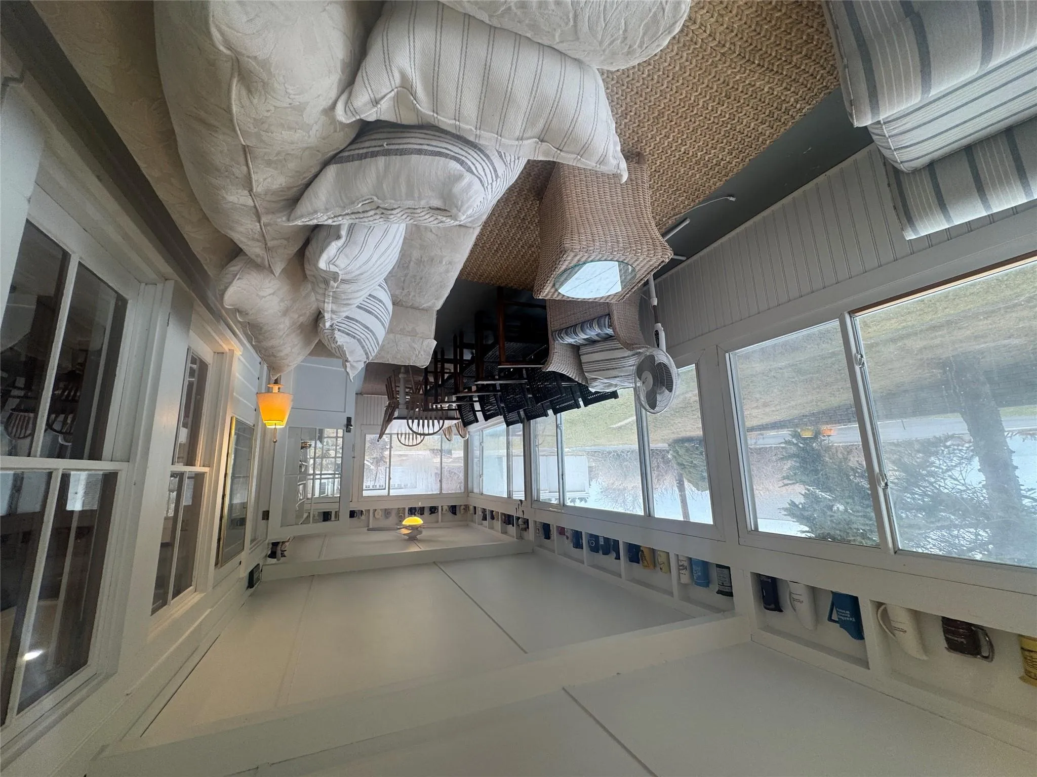 Sunroom / solarium featuring plenty of natural light and ceiling fan Sunroom / solarium featuring plenty of natural light and ceiling fan