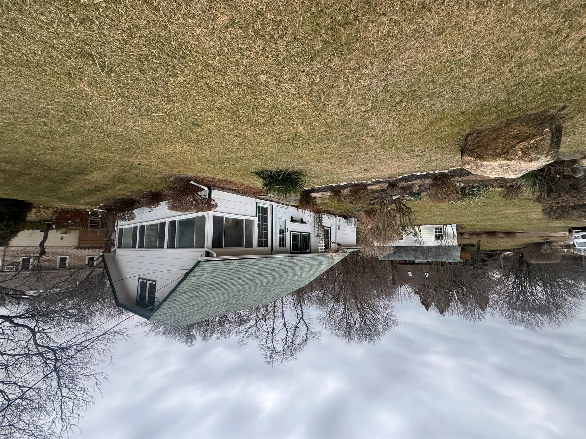 Back of house featuring a lawn Back of house featuring a lawn