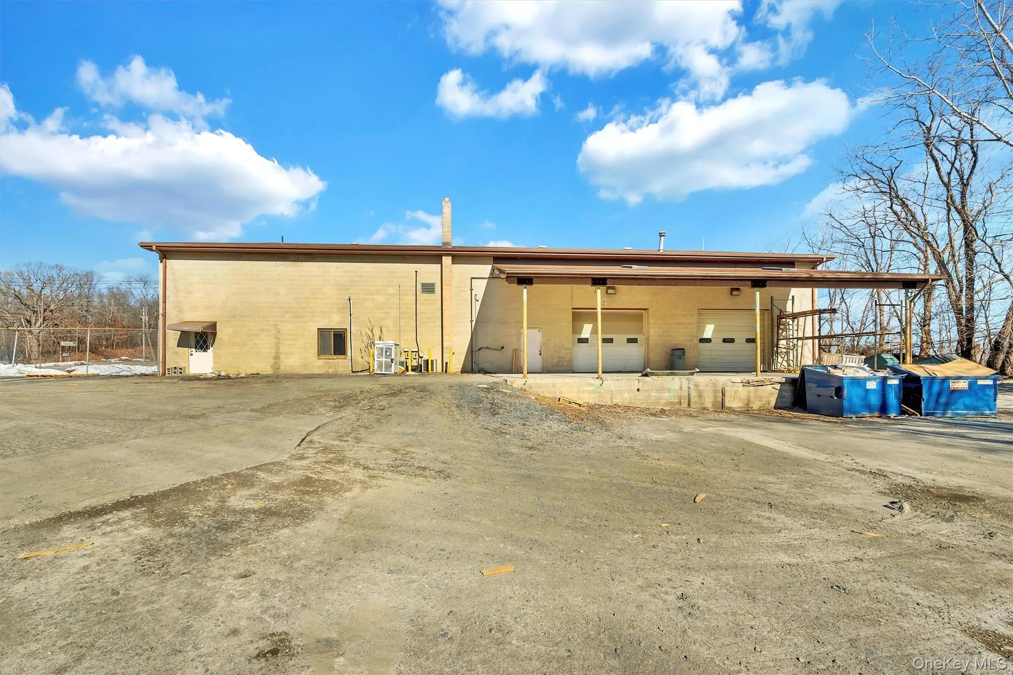 Rear view of house featuring a carport Rear view of house featuring a carport