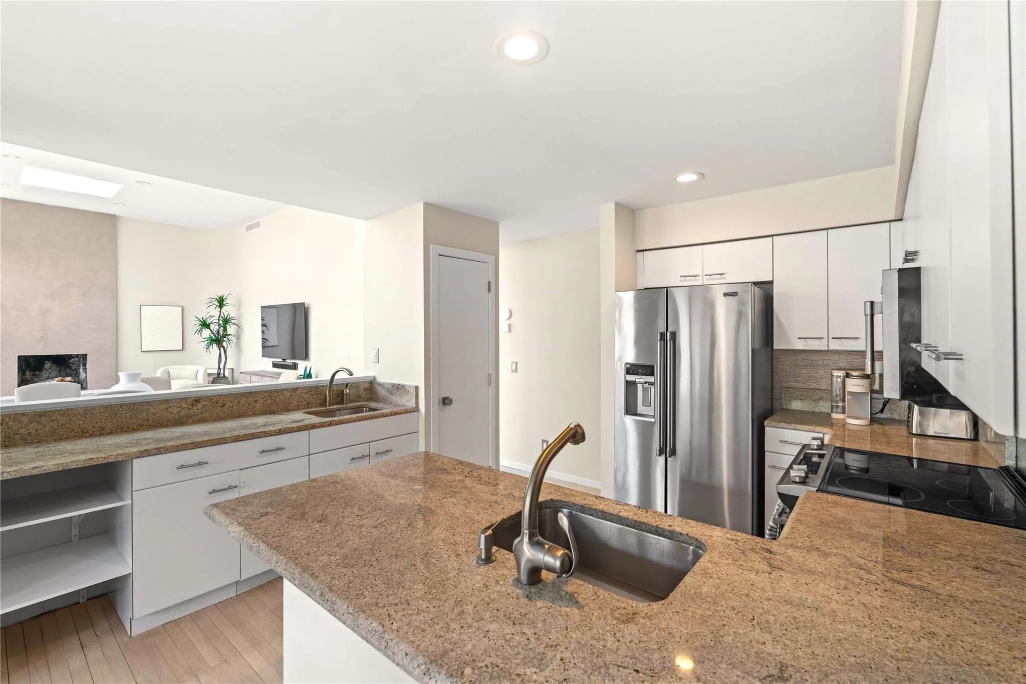 Open Kitchen featuring stainless steel appliances, sink, and white cabinets Open Kitchen featuring stainless steel appliances, sink, and white cabinets