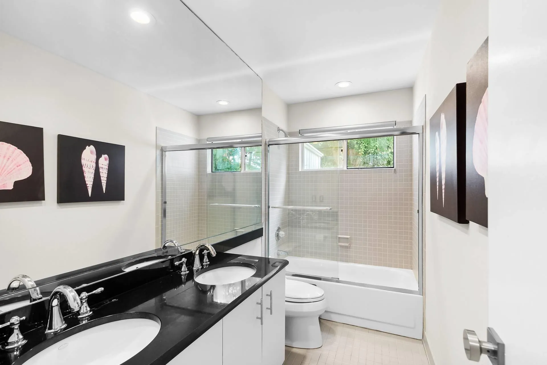 Full bathroom 1 of 3.5 featuring vanity, shower / bath combination with glass door, and toilet Full bathroom 1 of 3.5 featuring vanity, shower / bath combination with glass door, and toilet