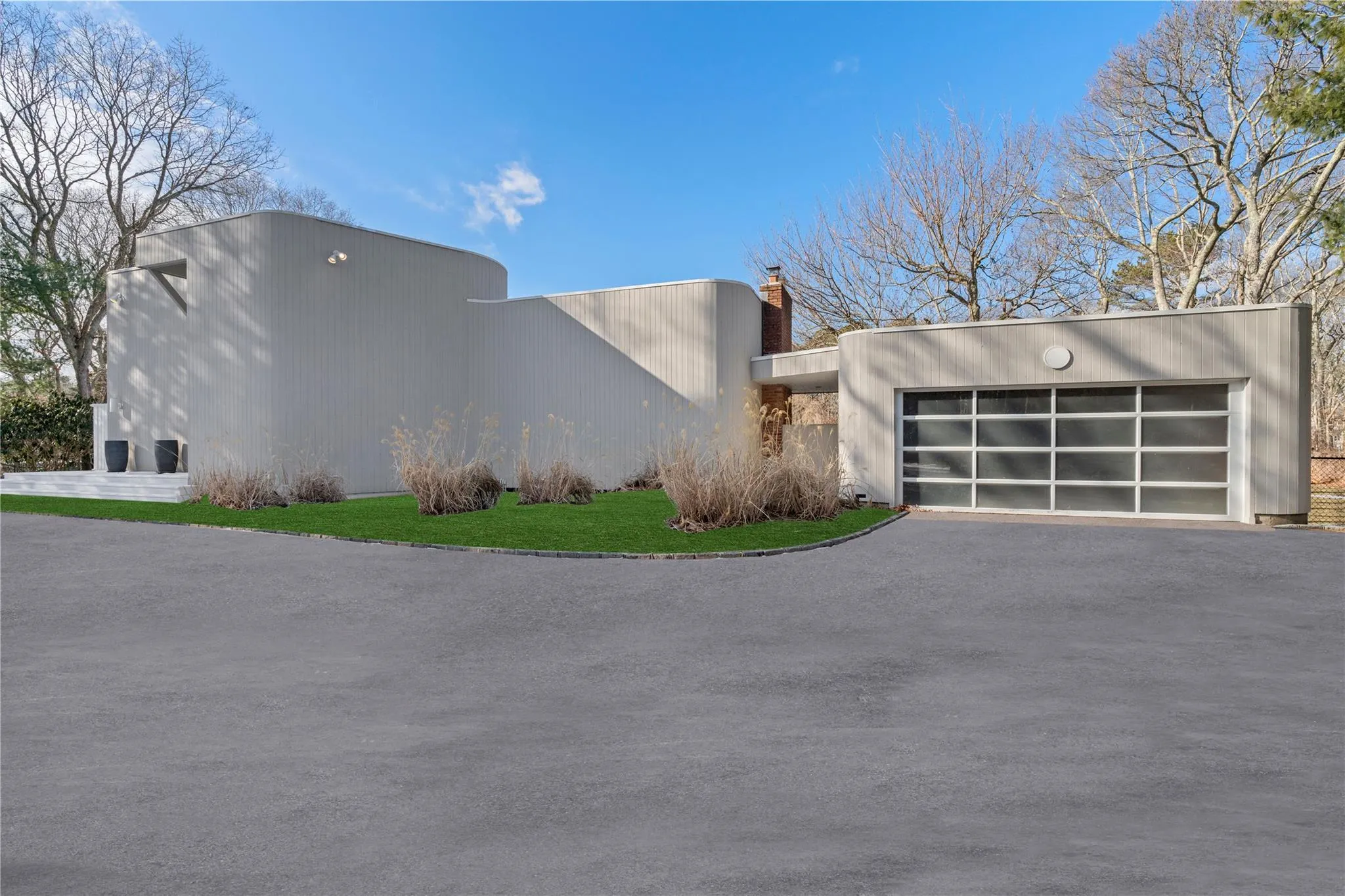 View of property exterior with a garage View of property exterior with a garage