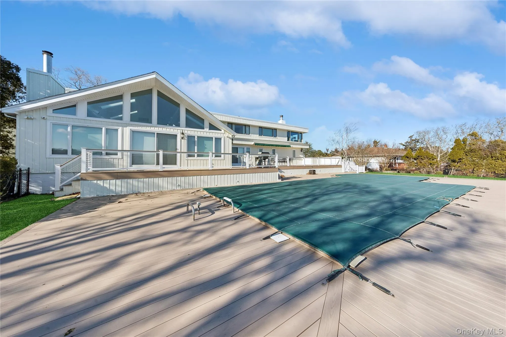 View of pool featuring a patio area View of pool featuring a patio area