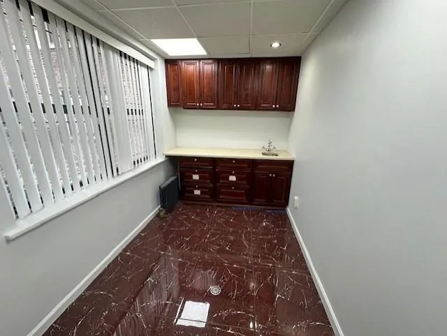 Laundry room with sink and radiator heating unit Laundry room with sink and radiator heating unit