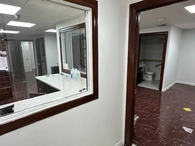 Hall featuring a paneled ceiling Hall featuring a paneled ceiling