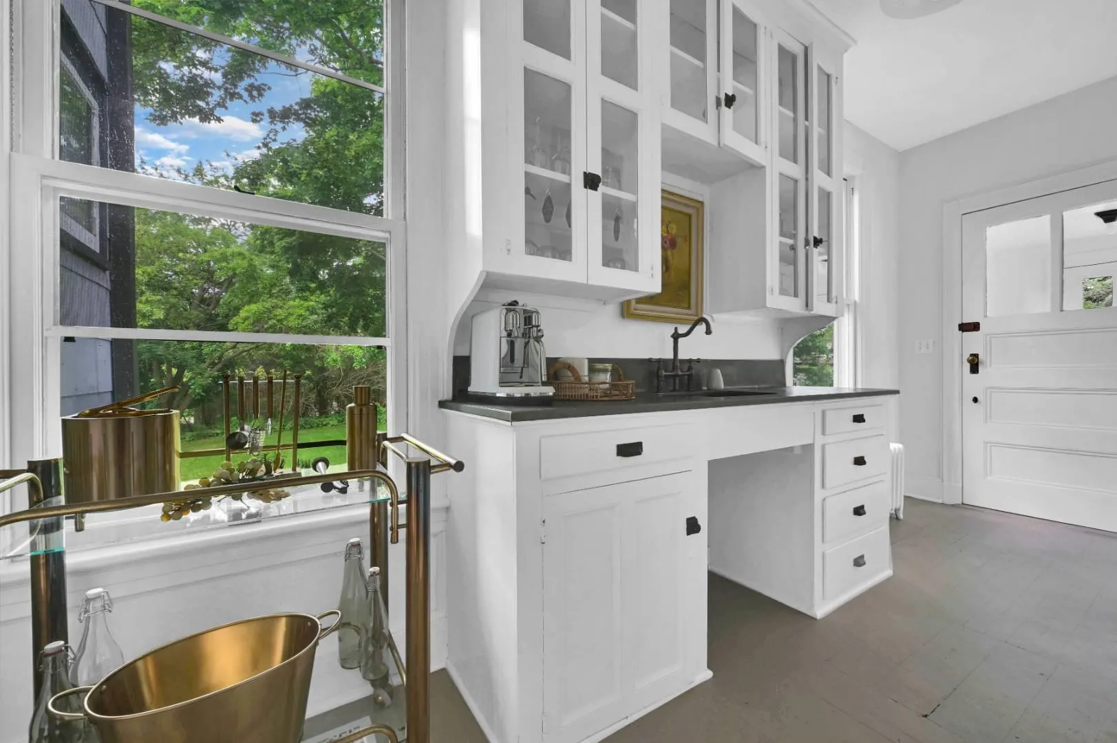 Kitchen with white cabinetry and sink Kitchen with white cabinetry and sink