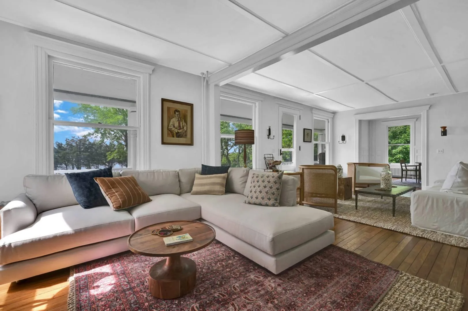 Living room with plenty of natural light and hardwood / wood-style floors Living room with plenty of natural light and hardwood / wood-style floors