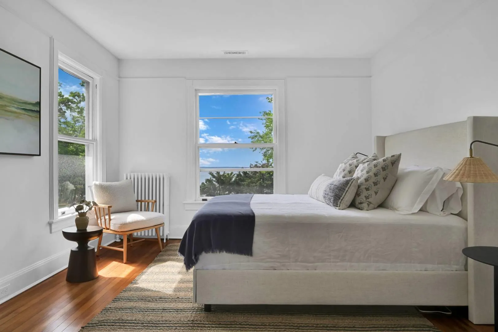 Bedroom featuring dark hardwood / wood-style floors and radiator Bedroom featuring dark hardwood / wood-style floors and radiator