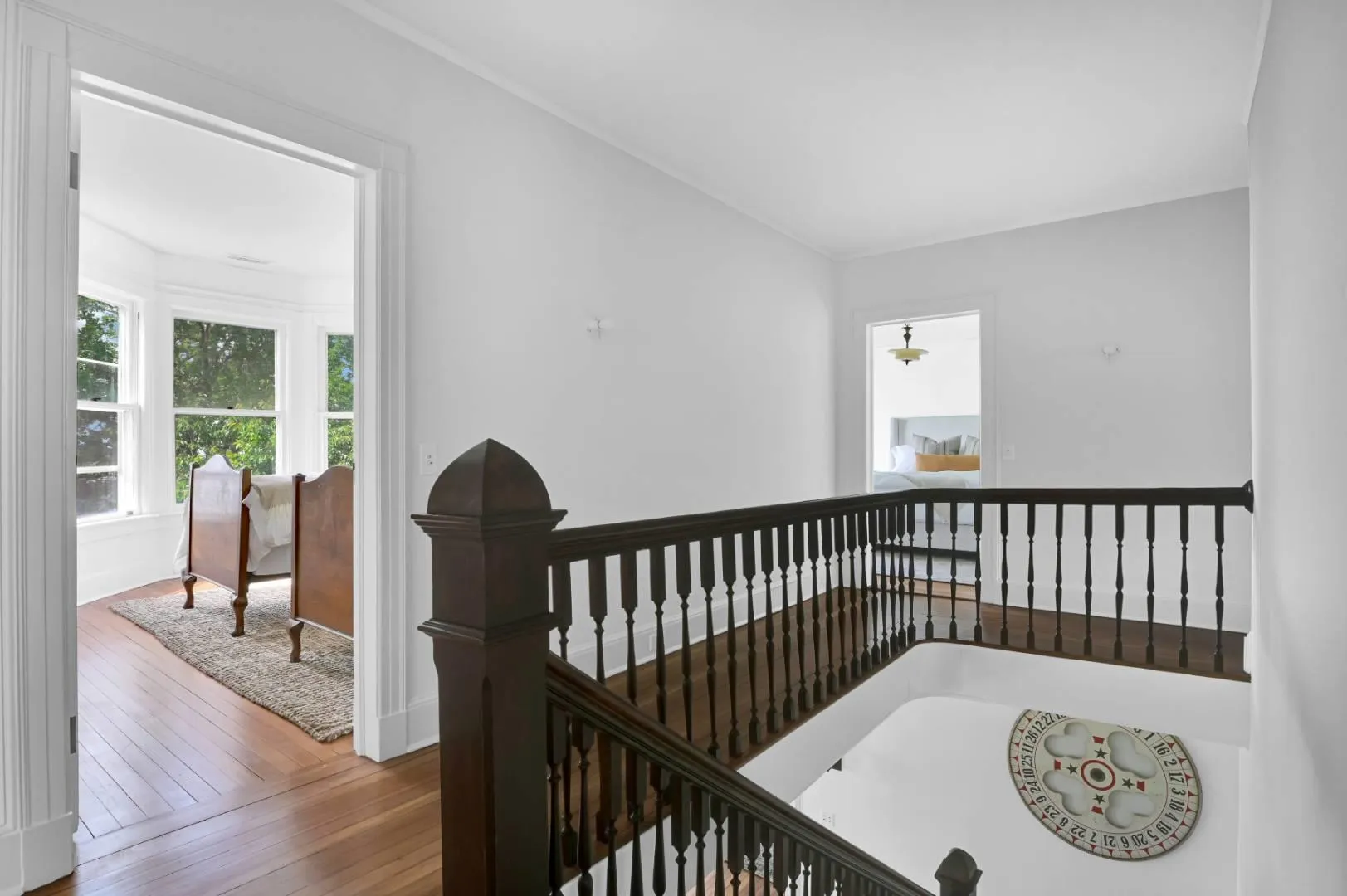 Corridor featuring hardwood / wood-style floors Corridor featuring hardwood / wood-style floors