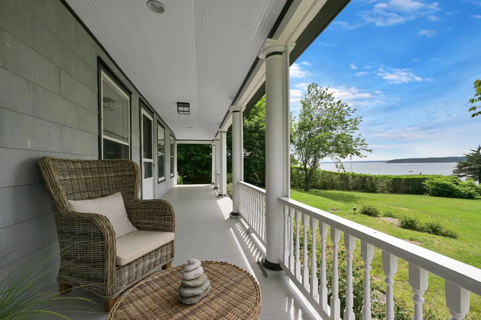 Balcony featuring a porch and a water view Balcony featuring a porch and a water view