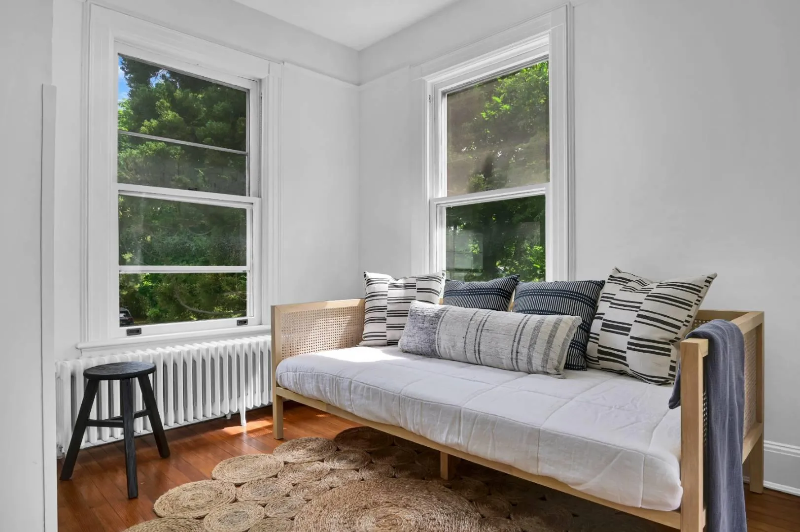 Sitting room featuring hardwood / wood-style flooring, plenty of natural light, and radiator Sitting room featuring hardwood / wood-style flooring, plenty of natural light, and radiator