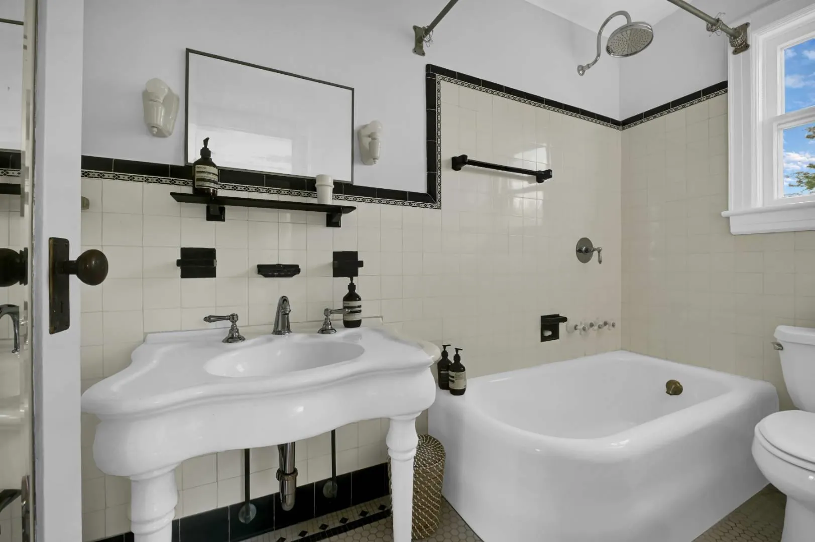 Bathroom featuring tile walls and toilet Bathroom featuring tile walls and toilet