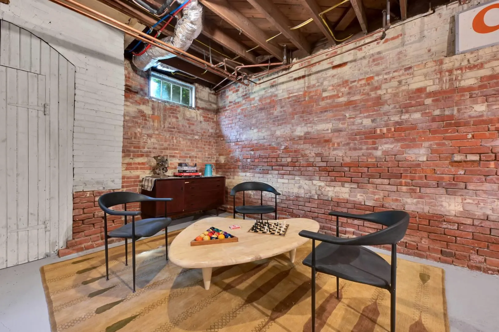 Sitting room featuring brick wall Sitting room featuring brick wall