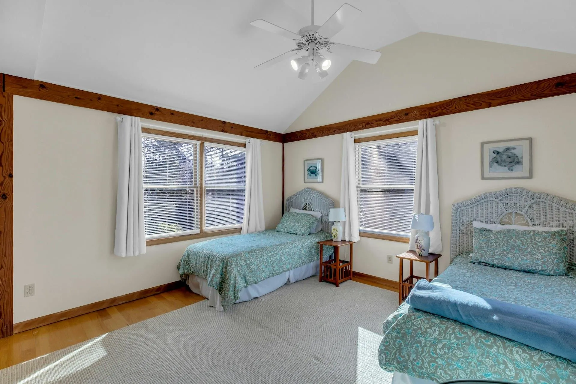 Bedroom with hardwood / wood-style flooring, ceiling fan, and lofted ceiling Bedroom with hardwood / wood-style flooring, ceiling fan, and lofted ceiling