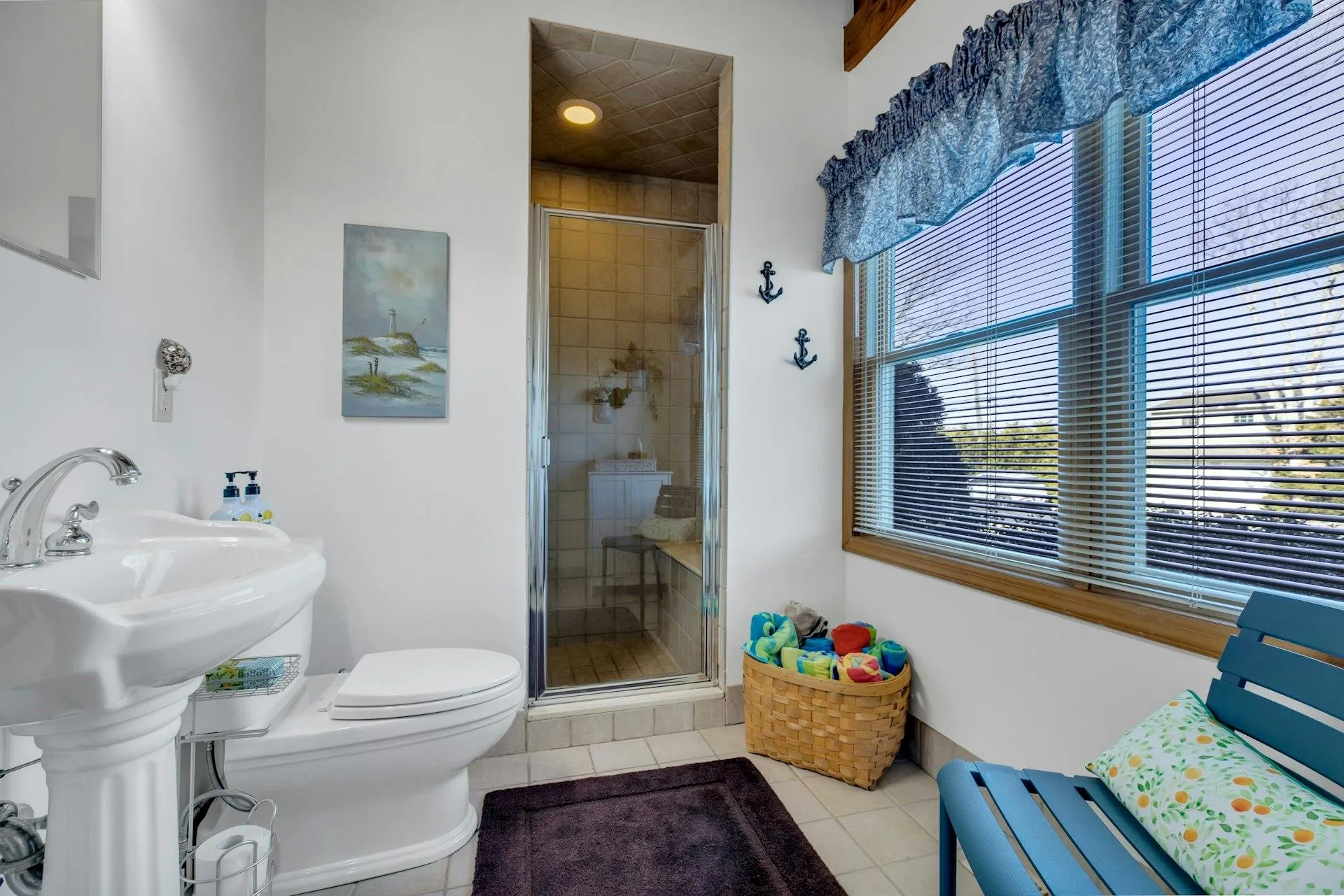 Bathroom featuring walk in shower, tile patterned floors, and toilet Bathroom featuring walk in shower, tile patterned floors, and toilet