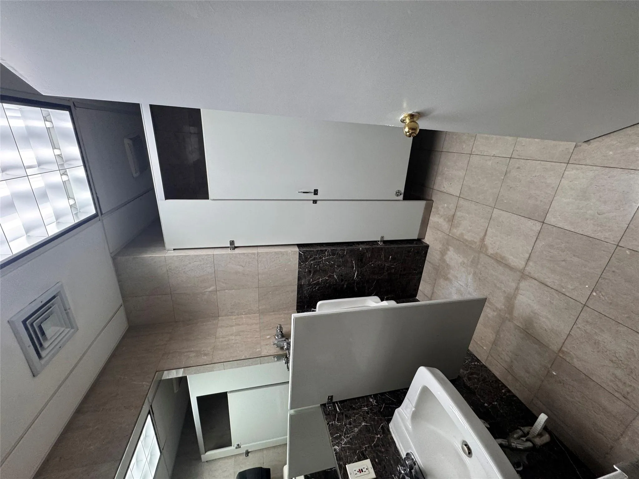 Bathroom featuring tile patterned flooring Bathroom featuring tile patterned flooring