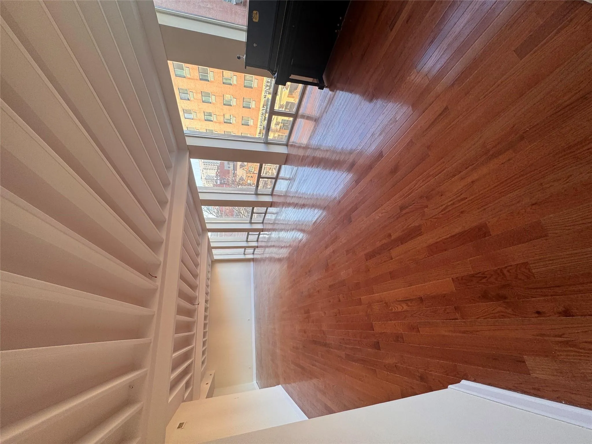 Spare room featuring wood finished floors Spare room featuring wood finished floors