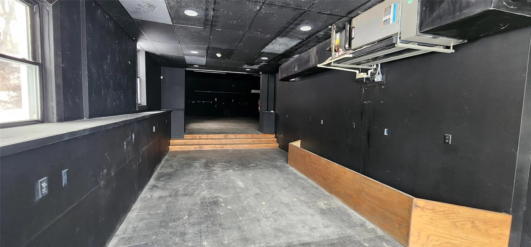 Corridor featuring a paneled ceiling Corridor featuring a paneled ceiling